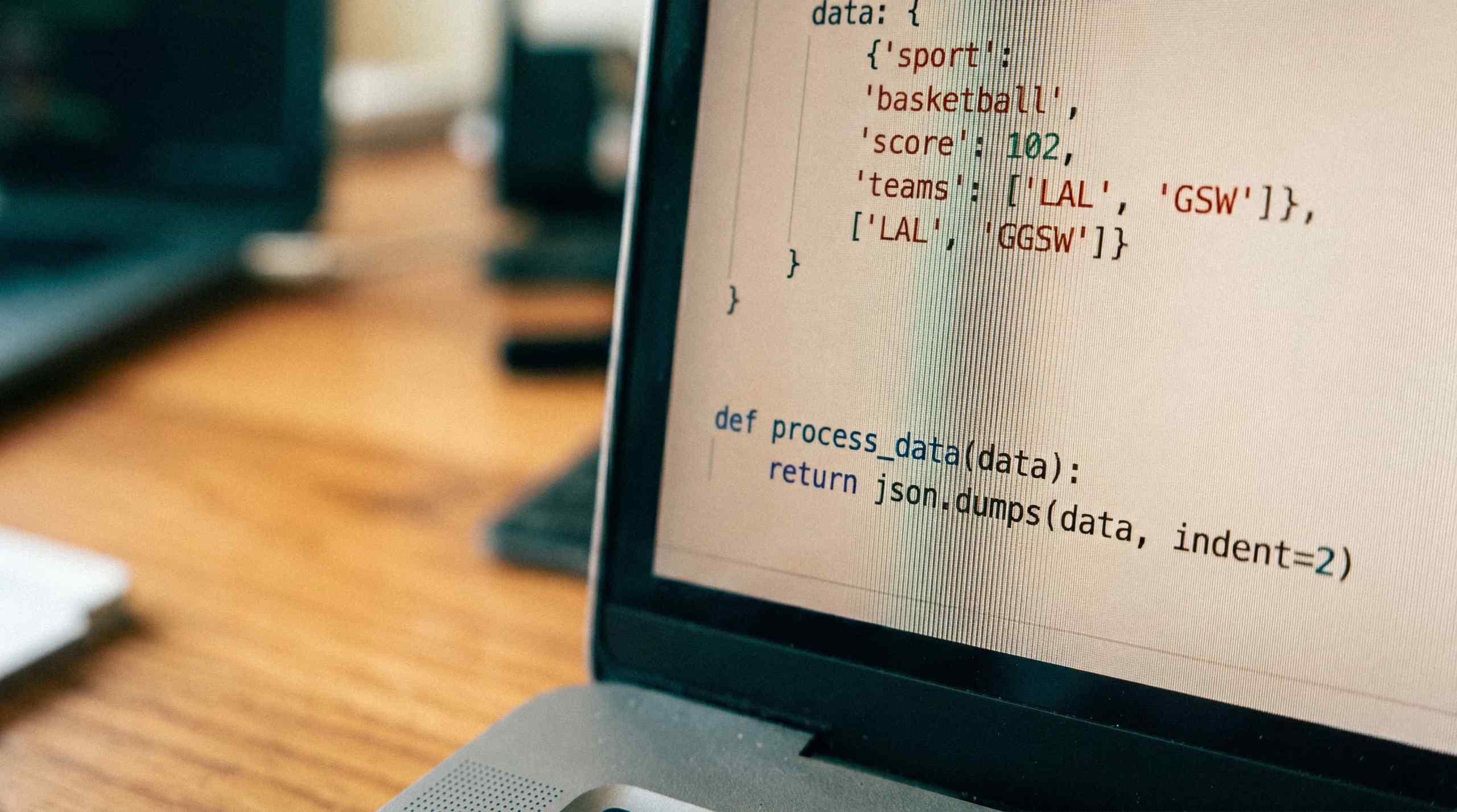A laptop showing some code.
